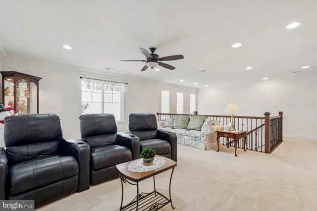 a bathroom with a toilet sink vanity and mirror