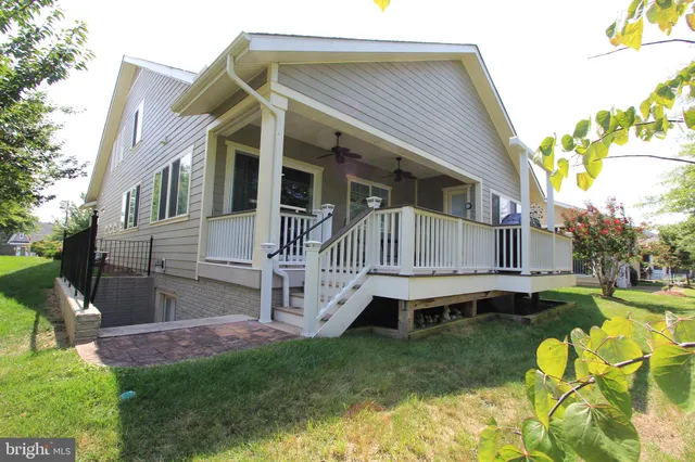 a dining room with furniture and a chandelier