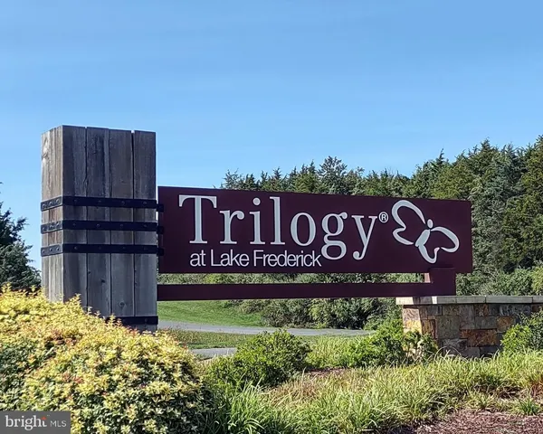 an aerial view of a house with a swimming pool yard and outdoor seating