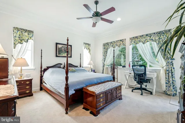 a large kitchen with a sink and refrigerator