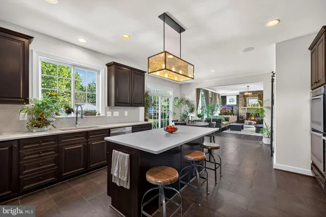 a kitchen with a table and chairs in it