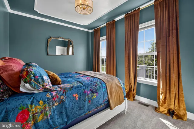 a bedroom with bed and a window