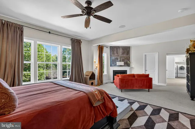a bedroom with bed and wooden floor