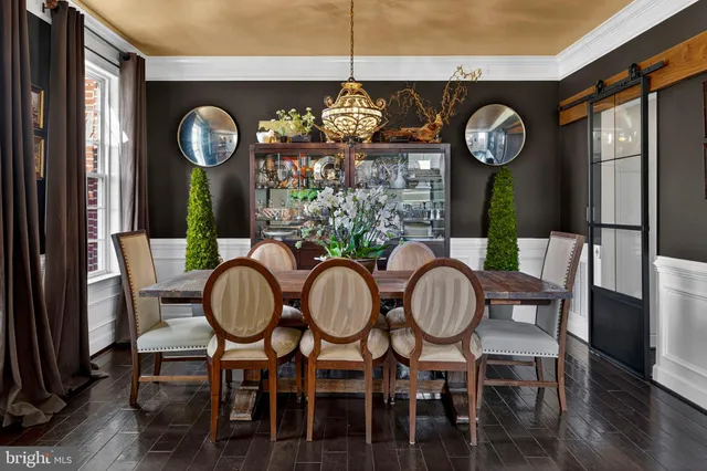 a view of a dining room with furniture wooden floor and entryway