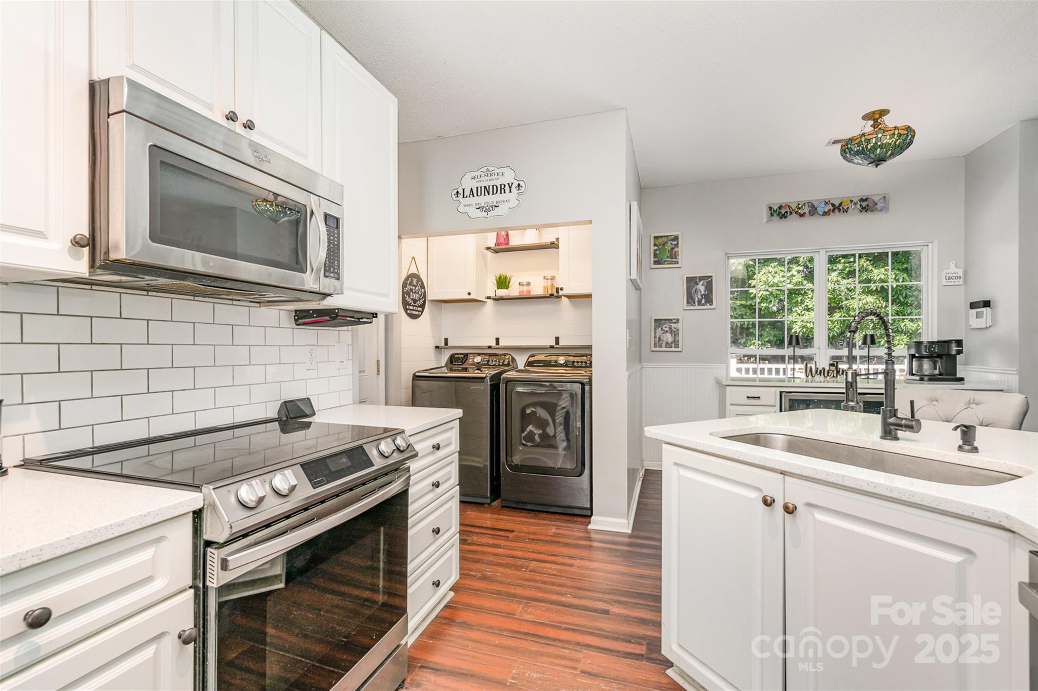 108 Shade Tree Circle Fort Mill, SC 29715 - Photo 11 of 36 a kitchen with a stove microwave and sink