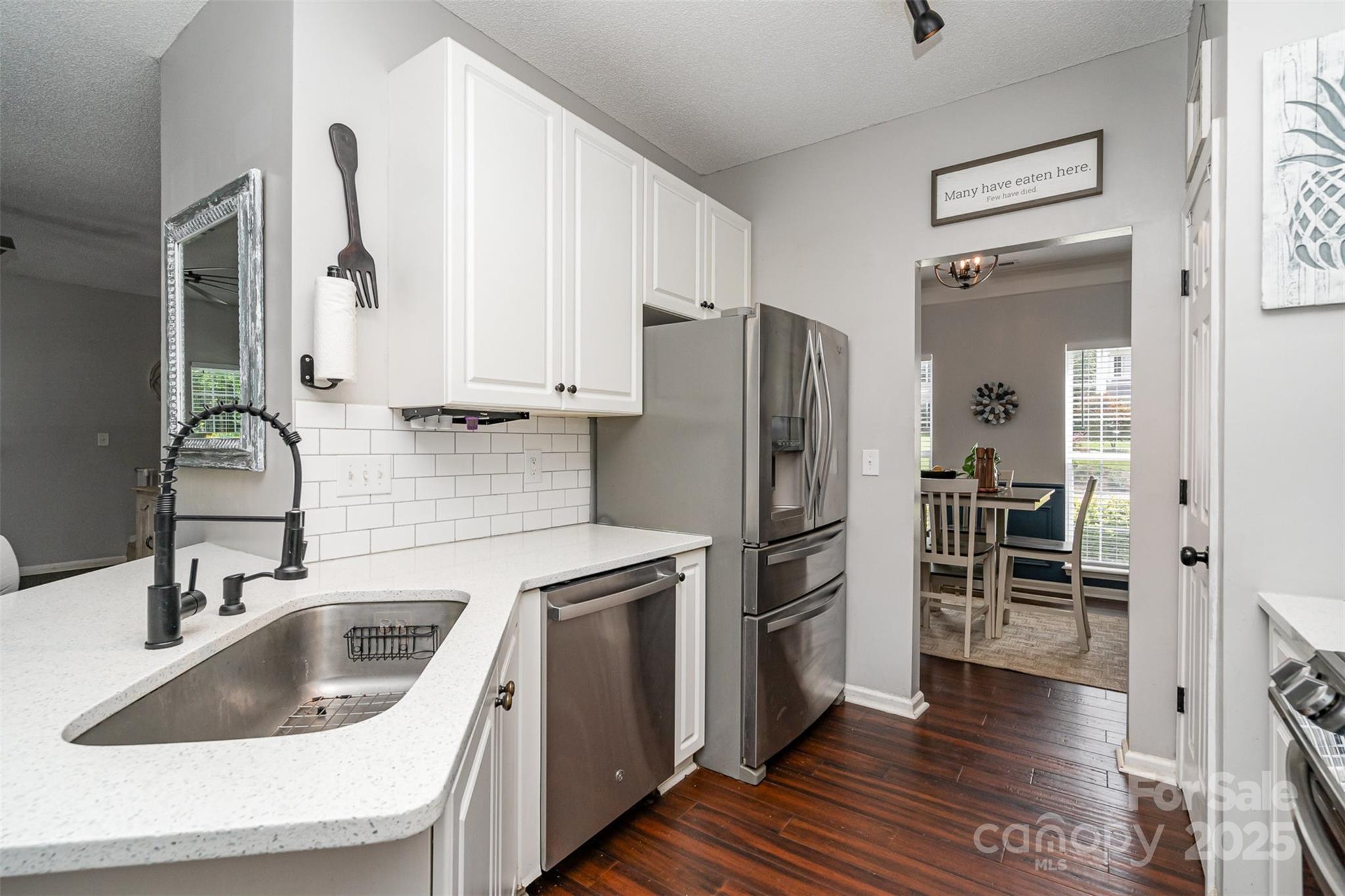 108 Shade Tree Circle Fort Mill, SC 29715 - Photo 12 of 36 a kitchen with wooden cabinets and stainless steel appliances