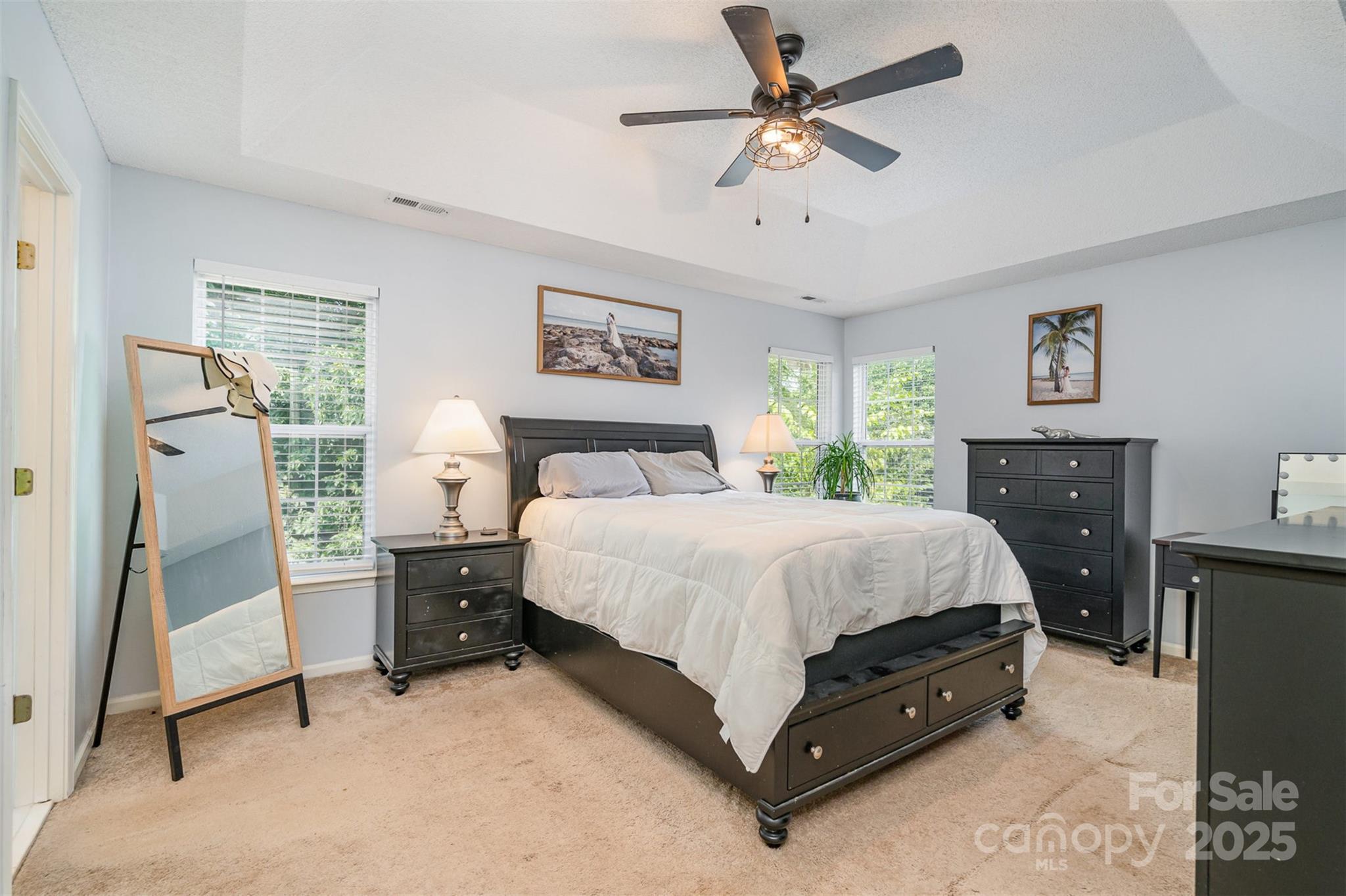108 Shade Tree Circle Fort Mill, SC 29715 - Photo 15 of 36 a bedroom with a bed and a chandelier