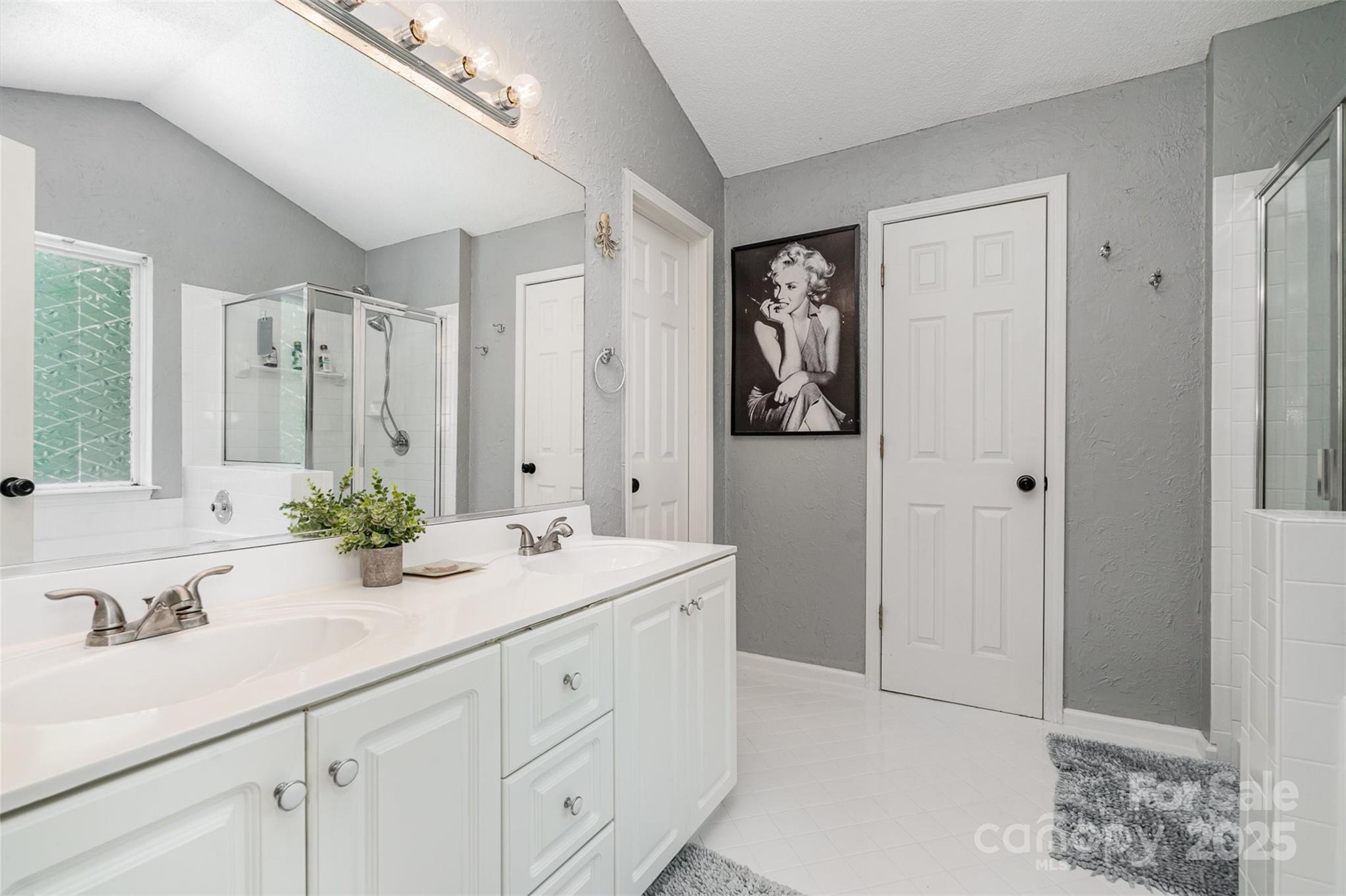 108 Shade Tree Circle Fort Mill, SC 29715 - Photo 17 of 36 a bathroom with double sink and a mirror