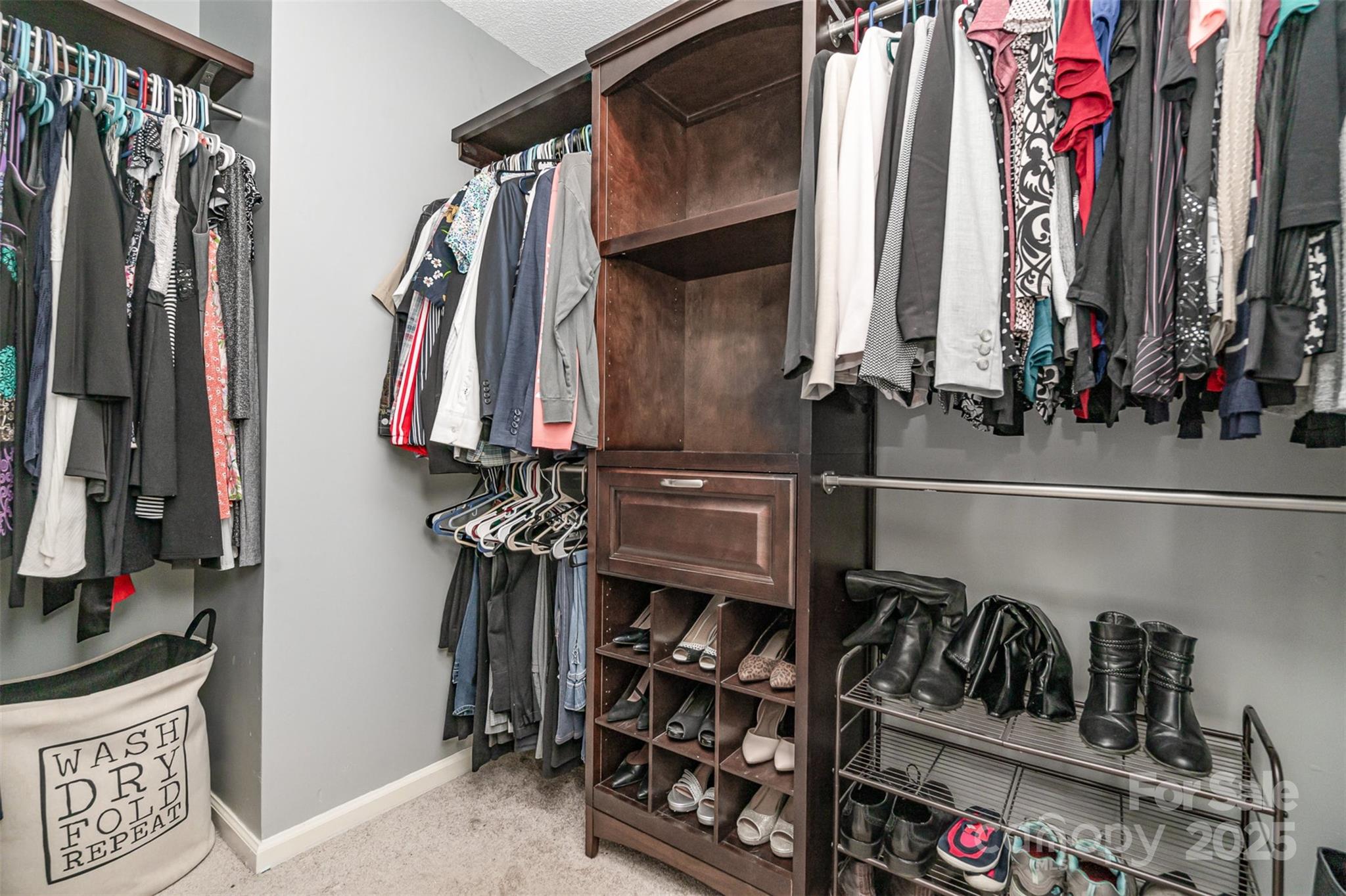 108 Shade Tree Circle Fort Mill, SC 29715 - Photo 19 of 36 a view of walk in closet with clothes and shoes