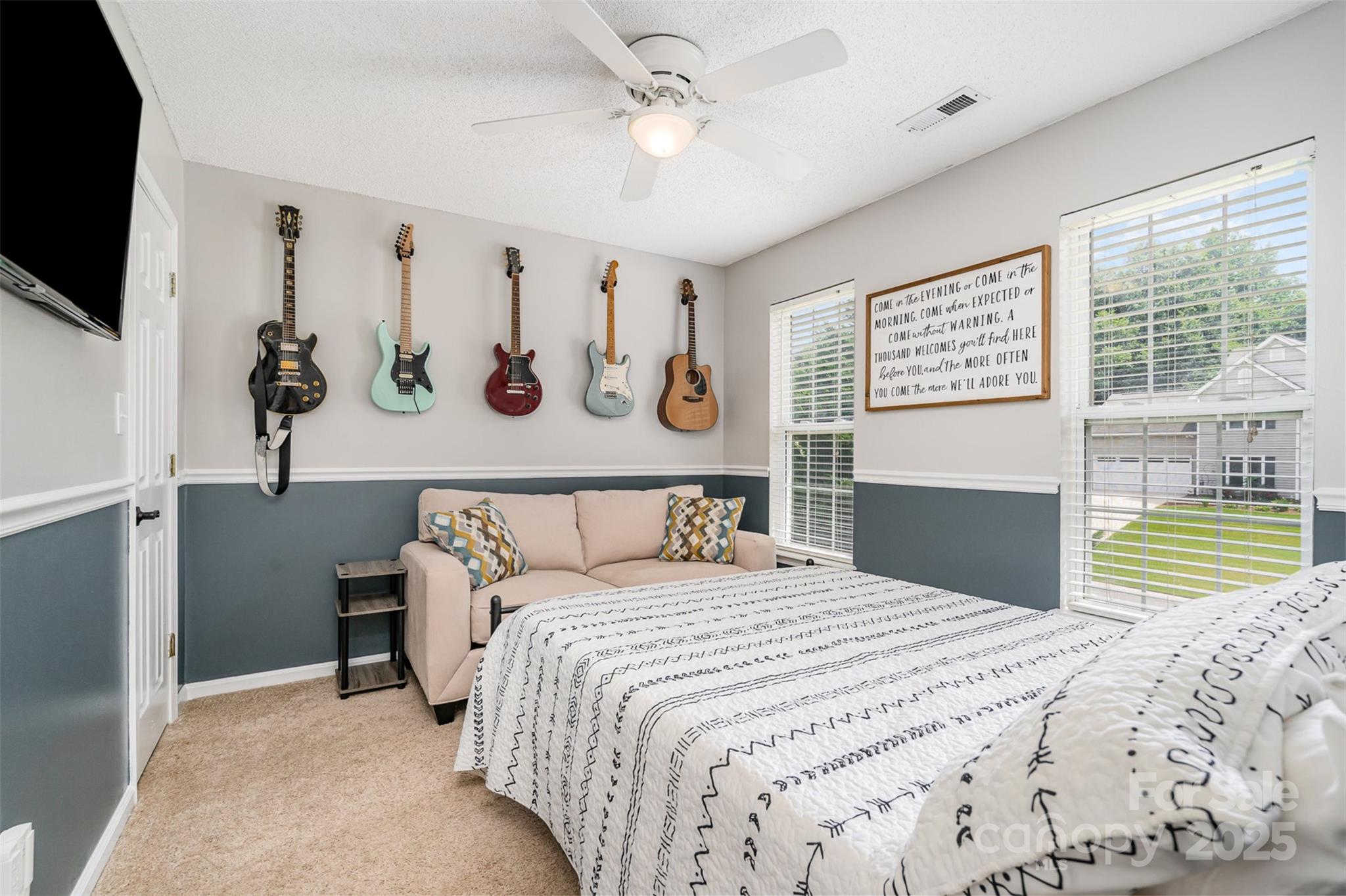 108 Shade Tree Circle Fort Mill, SC 29715 - Photo 20 of 36 a bedroom with a bed and a flat screen tv