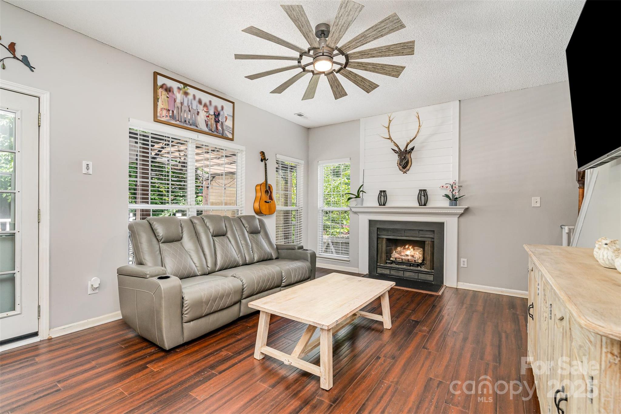 108 Shade Tree Circle Fort Mill, SC 29715 - Photo 6 of 36 a living room with furniture and a fireplace