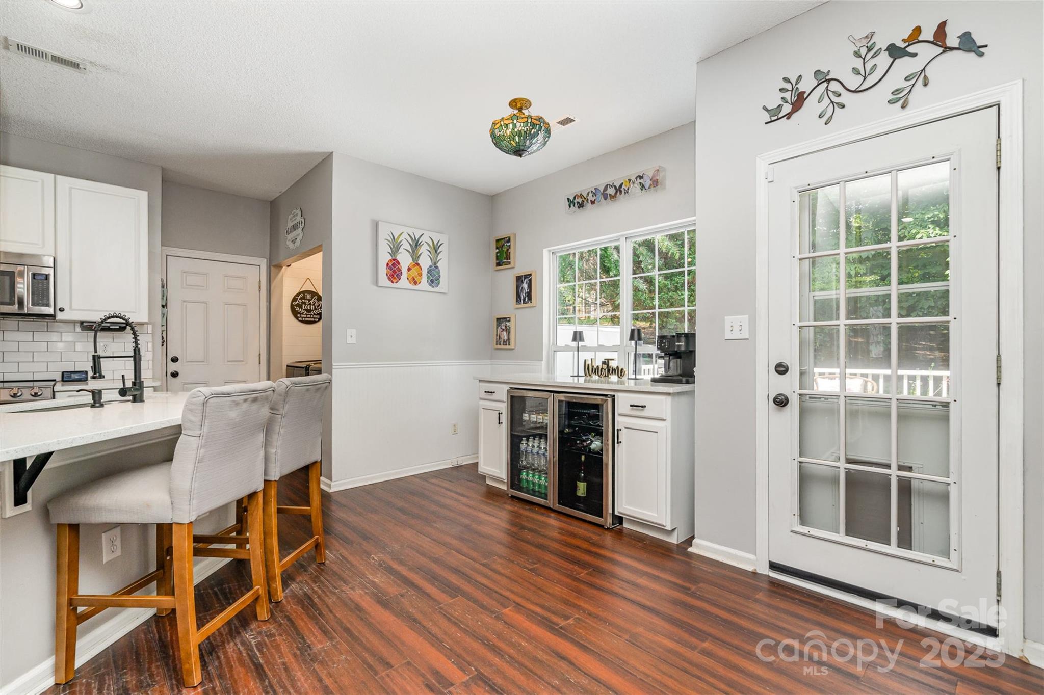 108 Shade Tree Circle Fort Mill, SC 29715 - Photo 9 of 36 a living room with stainless steel appliances granite countertop furniture and a wooden floor