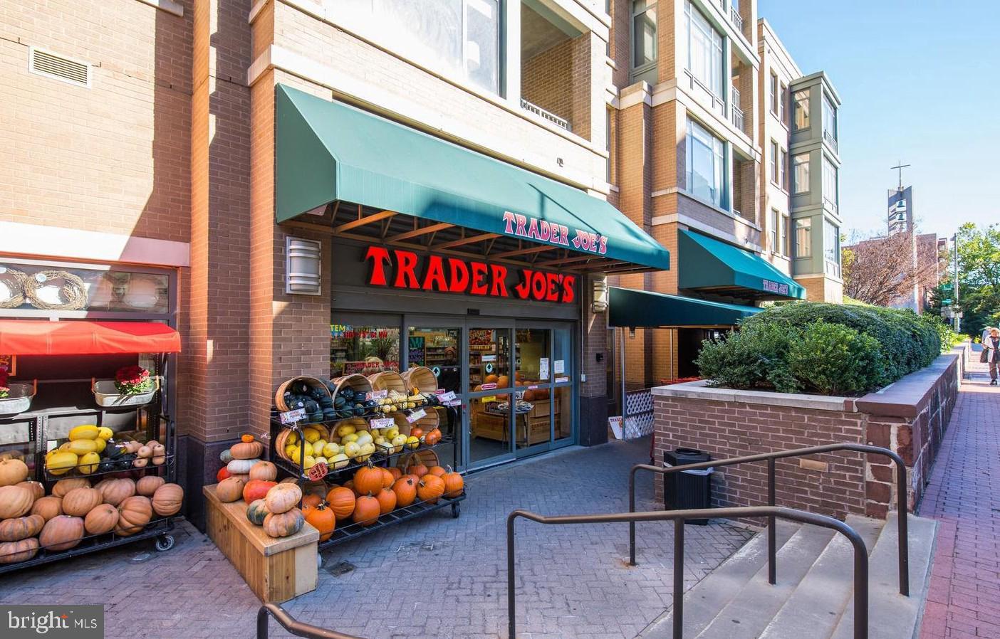 955 26th Street Northwest, Unit 506 Washington, DC 20037 - Photo 7 of 12 a variety of fruits and vegetables with building in the background
