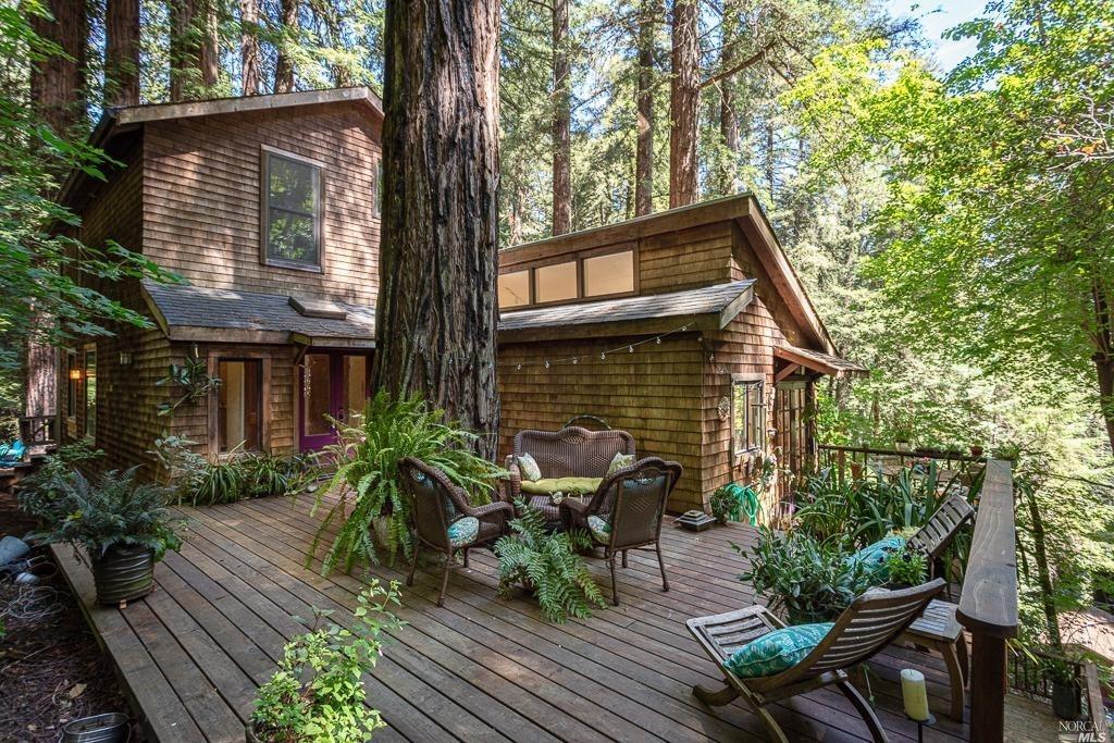 a view of backyard with sitting area