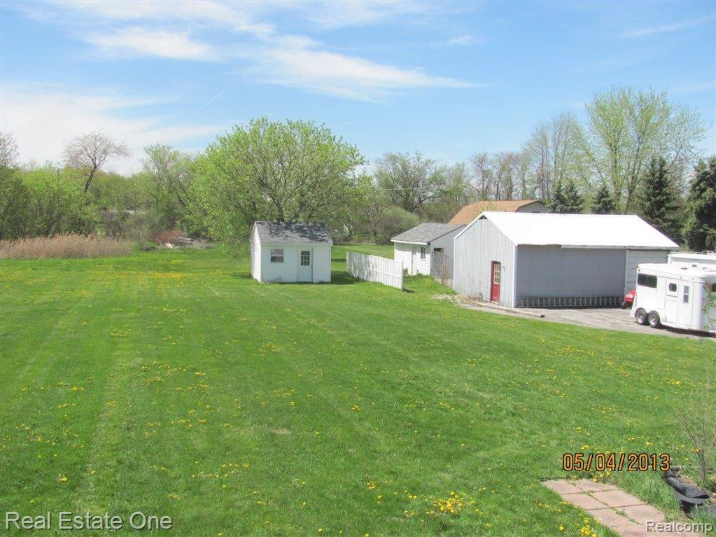 28796 Brandes Road Carleton, MI 48117 - Photo 18 of 20 Back yard with sheds and pole ba