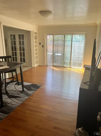 a view of an empty room with glass door