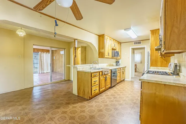 a large bathroom with a tub sink and mirror
