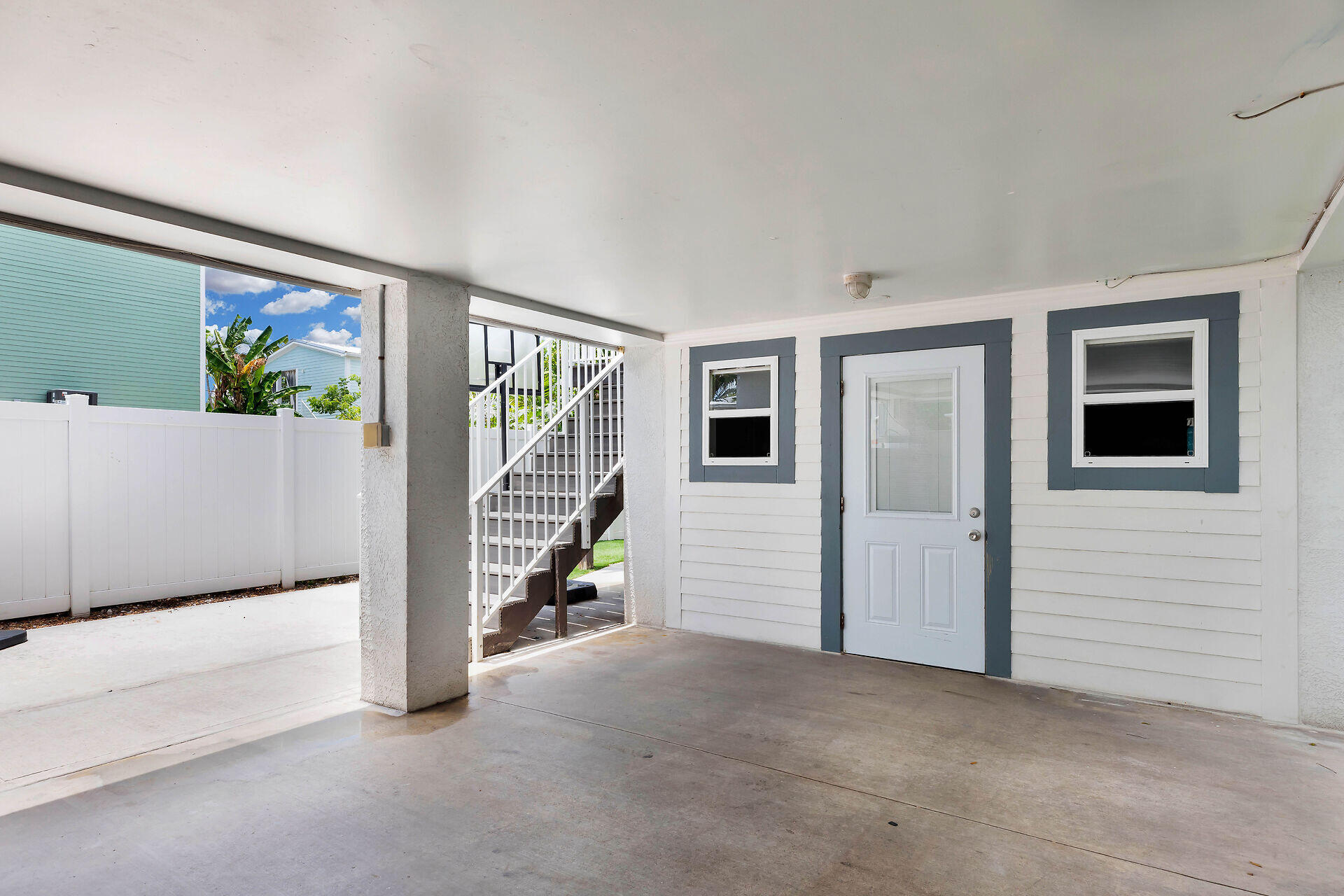 59 Ed Swift Road Key West, FL 33040 - Photo 29 of 35 a view of an empty room with window and stairs