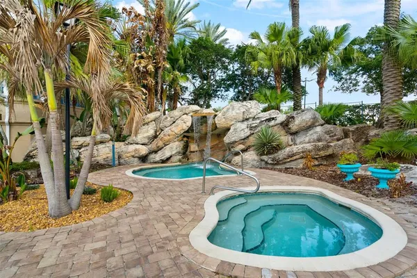 a view of a swimming pool with a yard