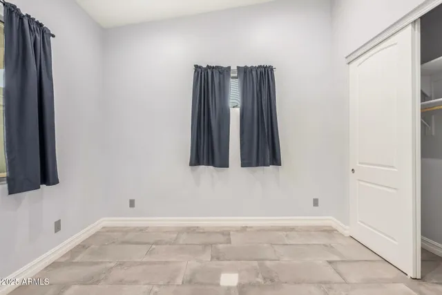 a view of a utility room with windows