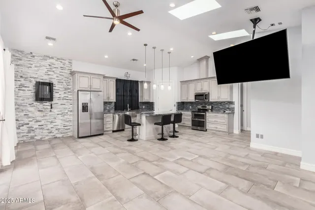 a view of living room with furniture and flat screen tv