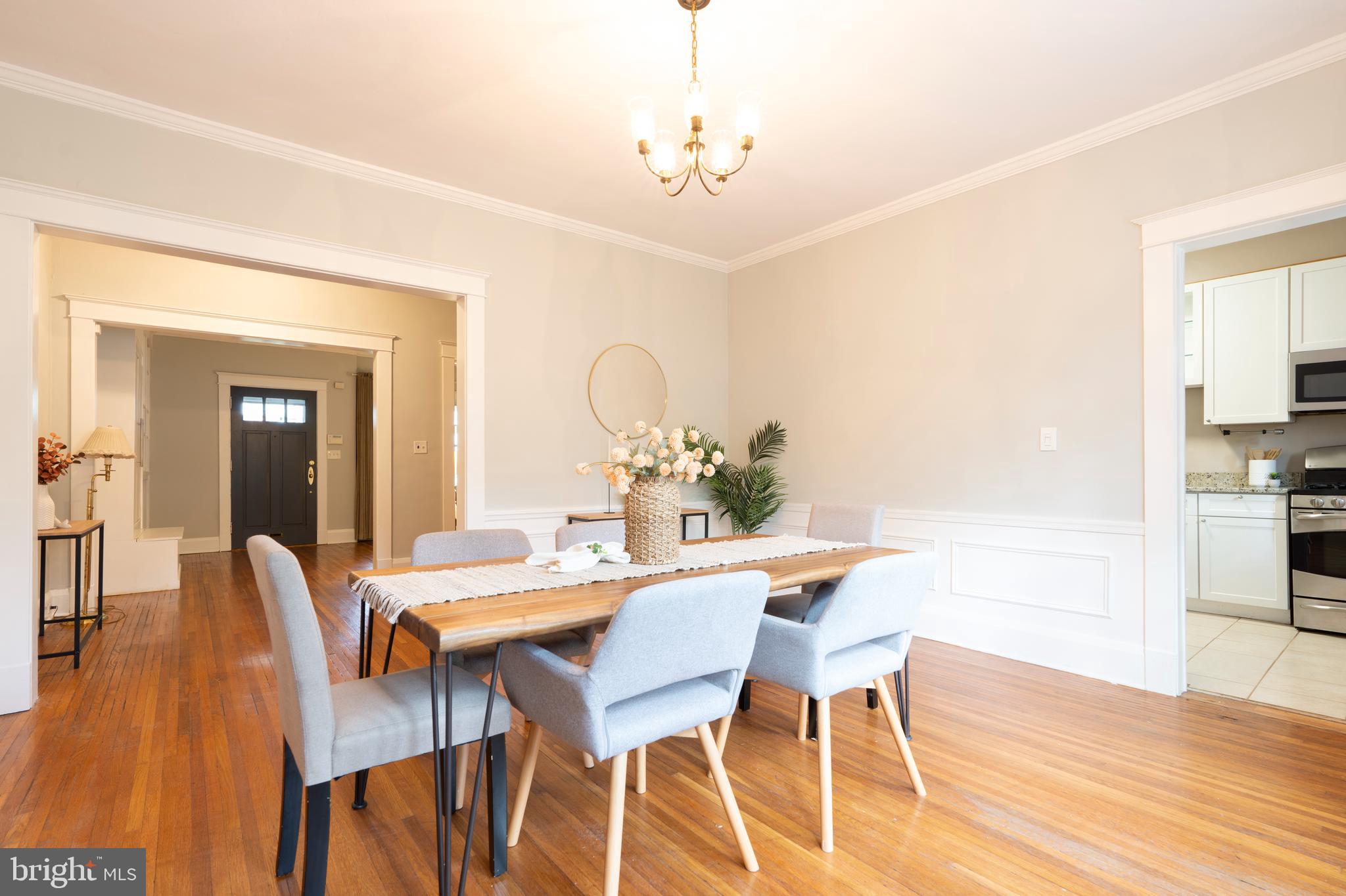 3541 Newland Road Baltimore, MD 21218 - Photo 15 of 68 a view of a dining room with furniture and wooden floor