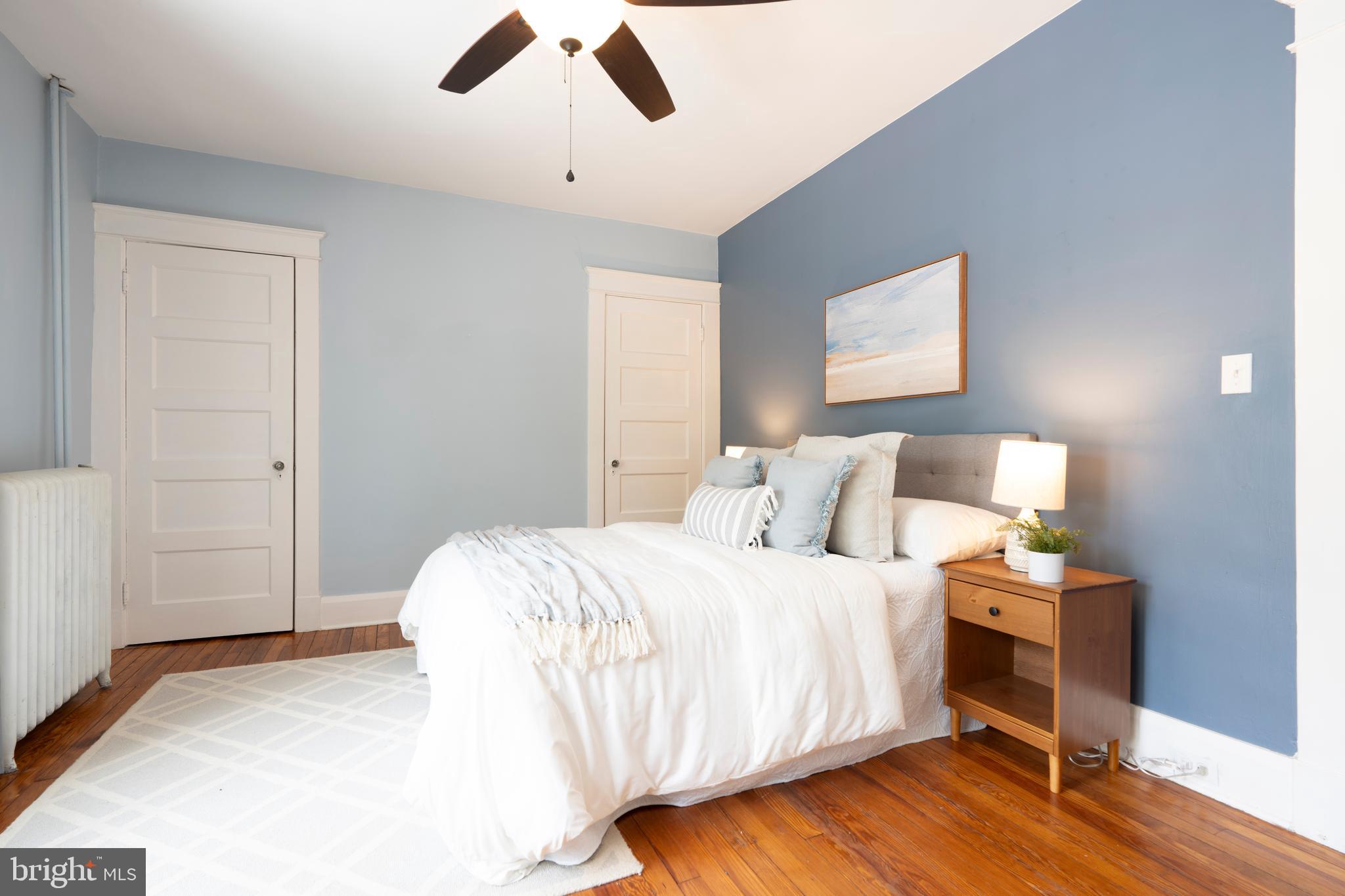 3541 Newland Road Baltimore, MD 21218 - Photo 24 of 68 a bedroom with a bed and wooden floor