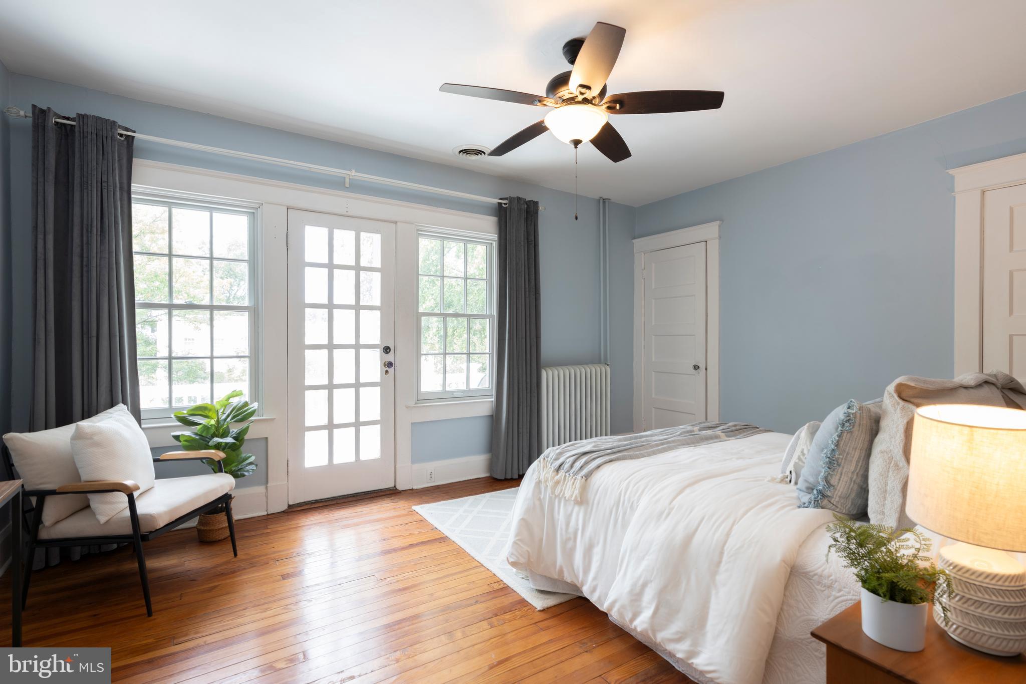 3541 Newland Road Baltimore, MD 21218 - Photo 27 of 68 a bedroom with a bed and a potted plant