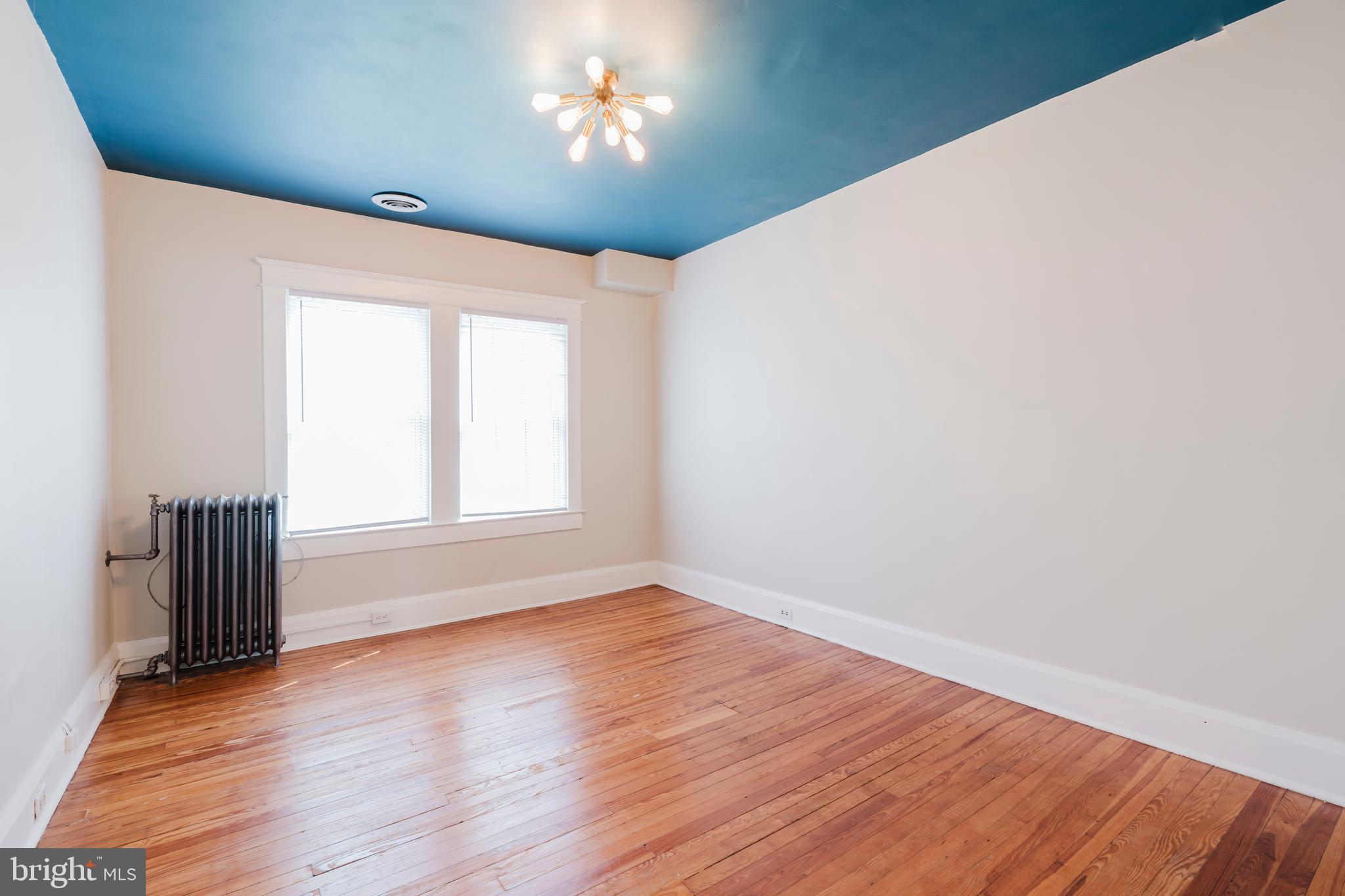 3541 Newland Road Baltimore, MD 21218 - Photo 34 of 68 a view of empty room with wooden floor and fan