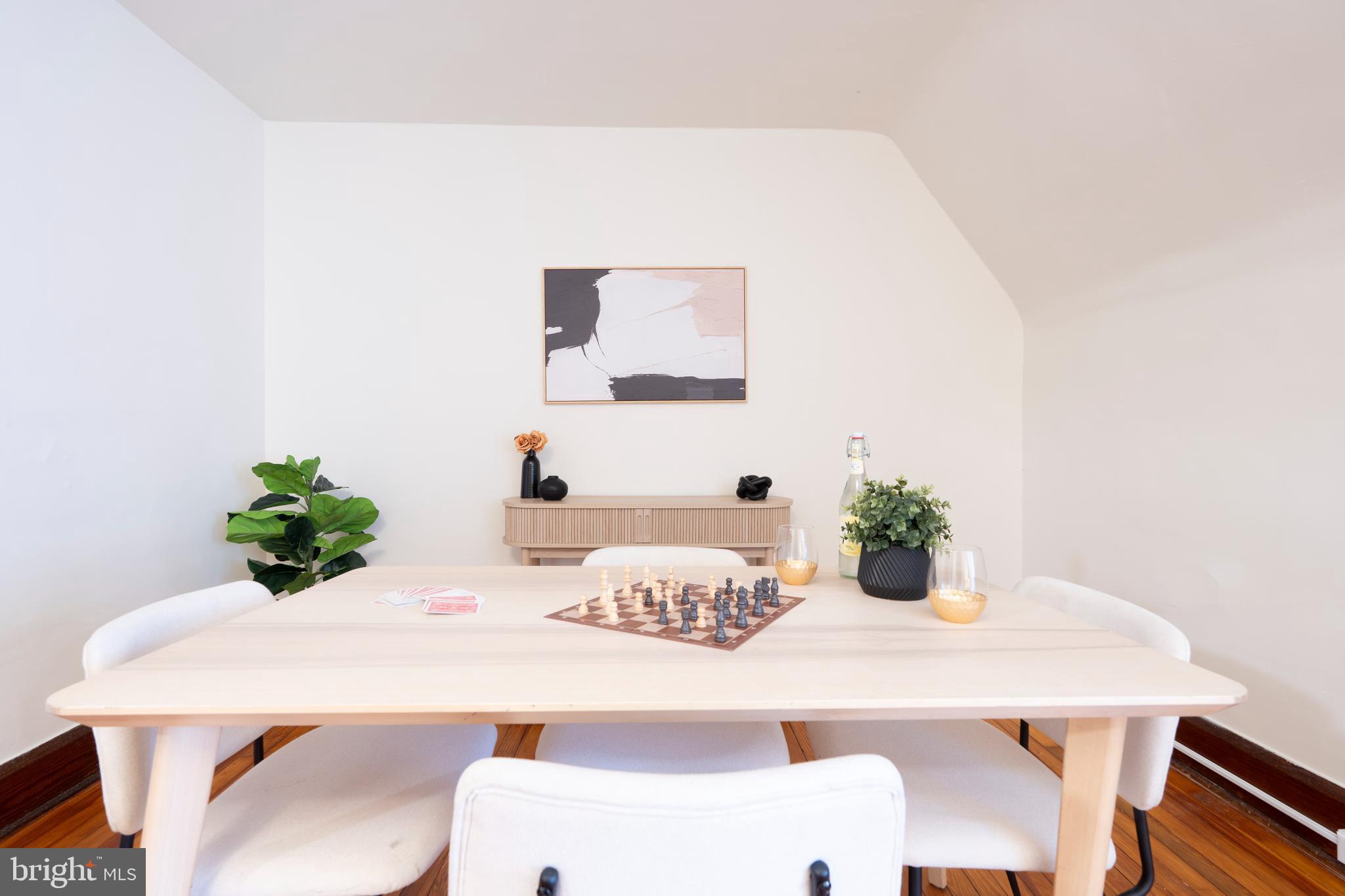 3541 Newland Road Baltimore, MD 21218 - Photo 40 of 68 a dining room with furniture and potted plant