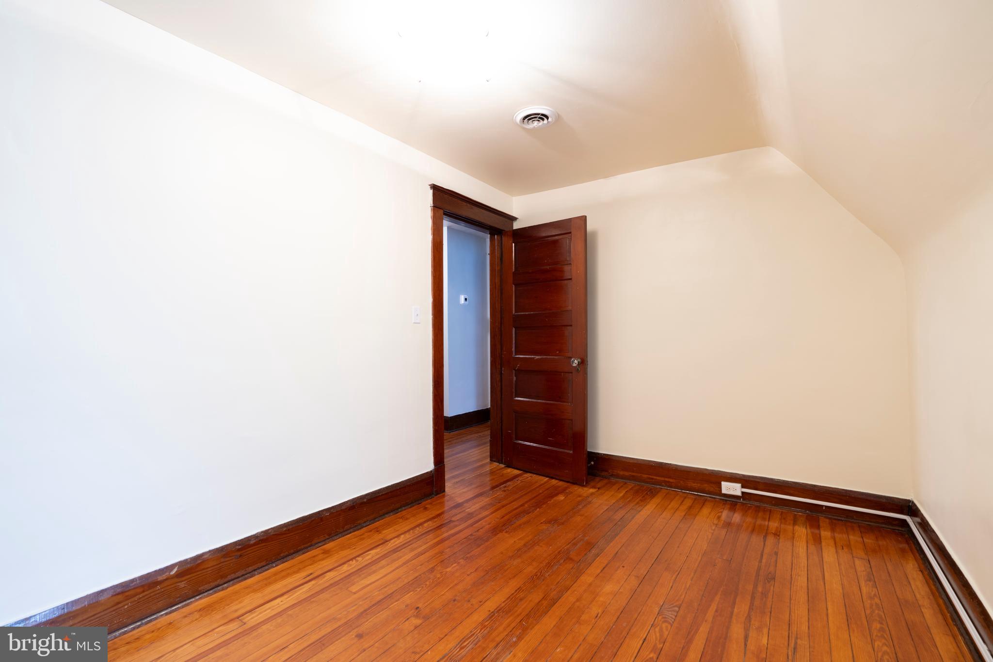 3541 Newland Road Baltimore, MD 21218 - Photo 55 of 68 a view of an empty room with wooden floor