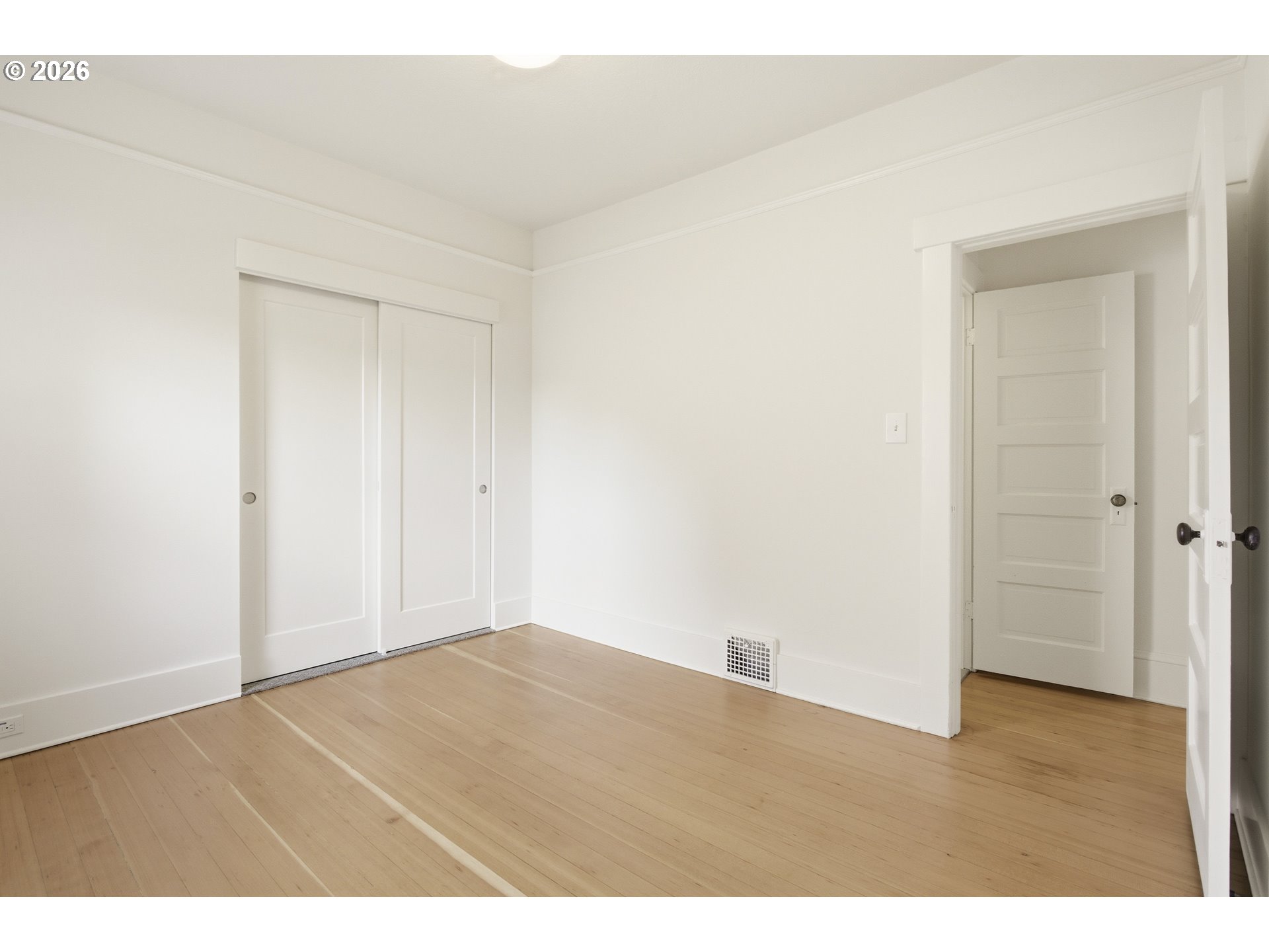 4036 Northeast Senate Street Portland, OR 97232 - Photo 16 of 48 an empty room with wooden floor