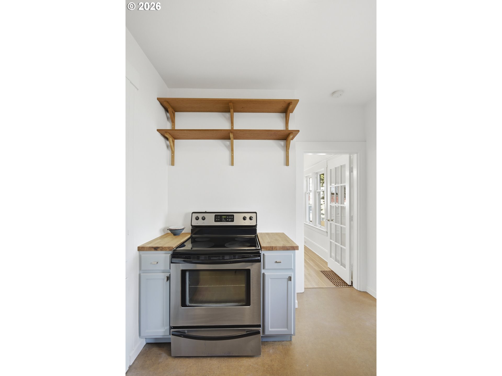 4036 Northeast Senate Street Portland, OR 97232 - Photo 19 of 48 a kitchen with a stove and a microwave