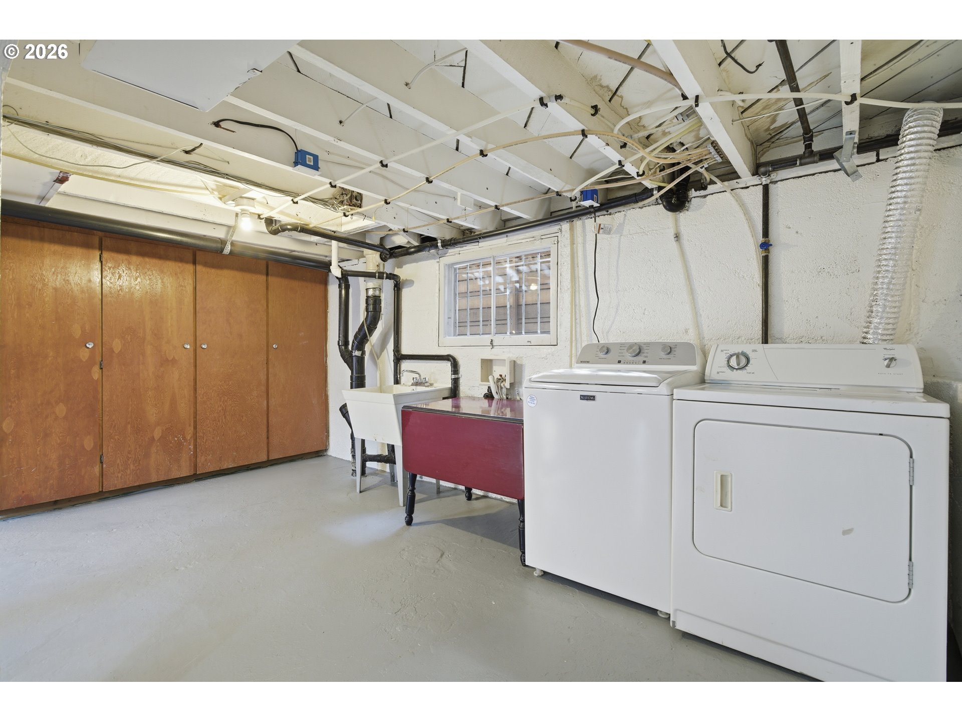 4036 Northeast Senate Street Portland, OR 97232 - Photo 27 of 48 a view of a storage & utility room with washer and dryer