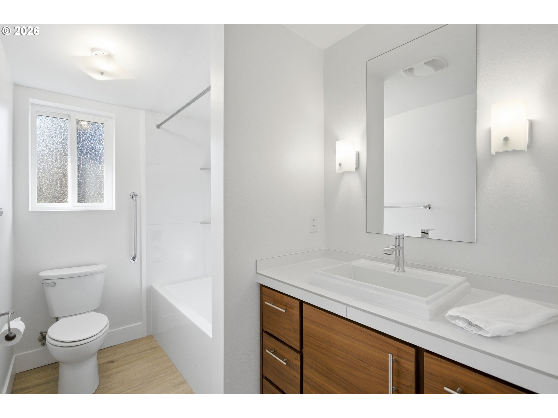 4036 Northeast Senate Street Portland, OR 97232 - Photo 36 of 48 a bathroom with a granite countertop sink toilet a large mirror and shower