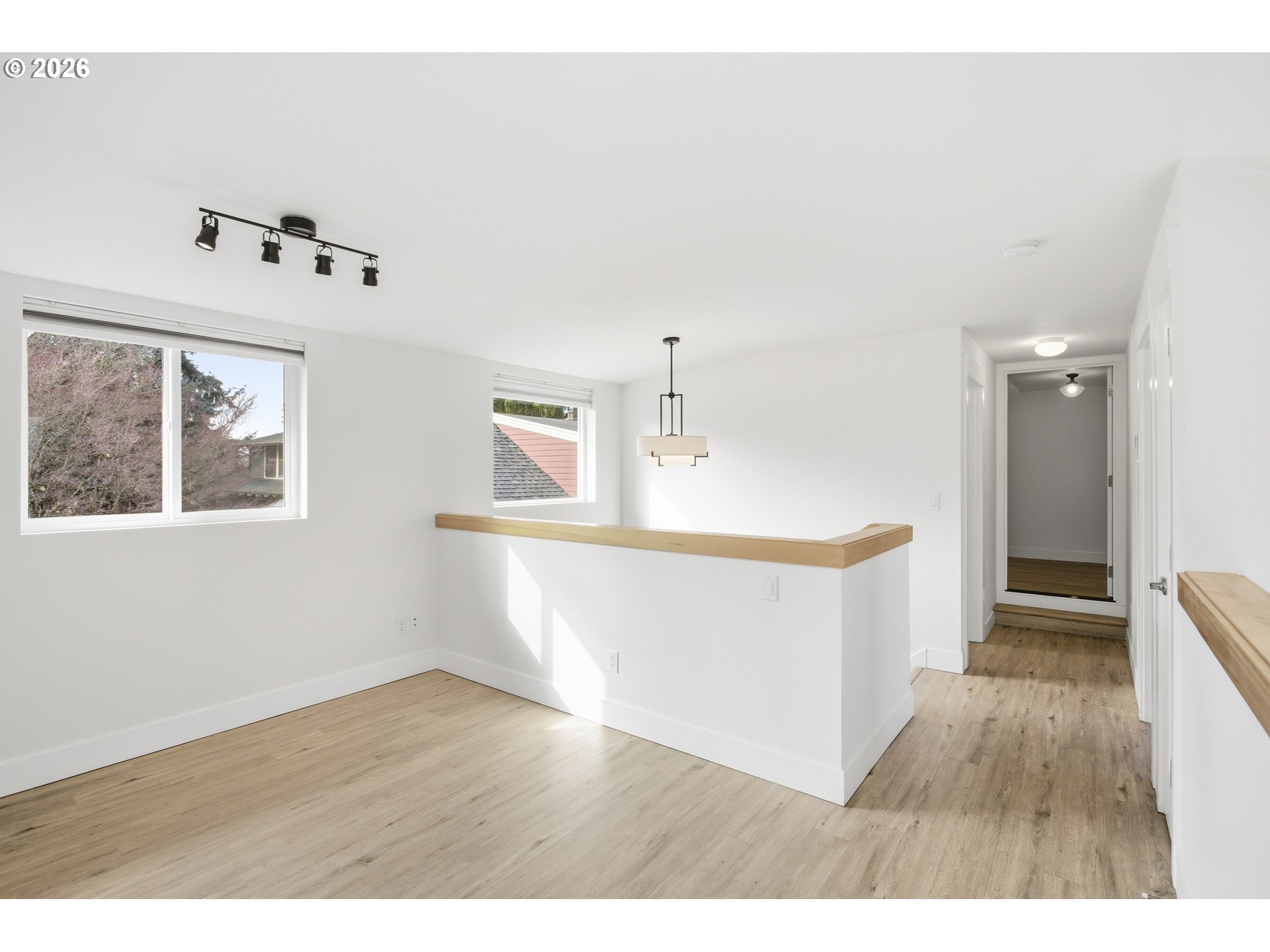 4036 Northeast Senate Street Portland, OR 97232 - Photo 37 of 48 a view of an empty room with wooden floor and a window