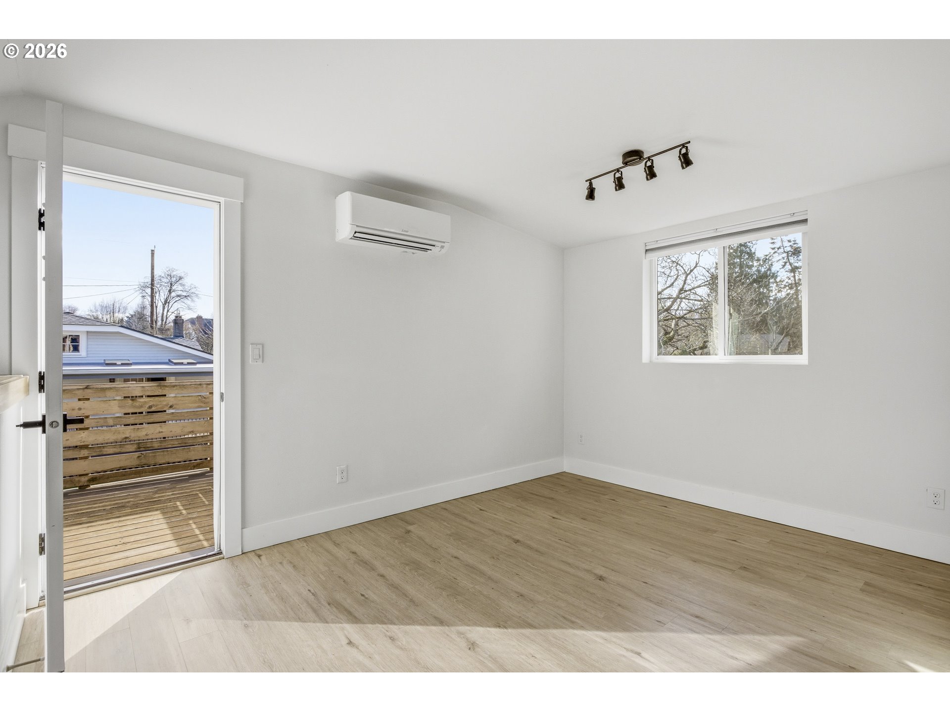 4036 Northeast Senate Street Portland, OR 97232 - Photo 38 of 48 a view of an empty room with wooden floor and a window