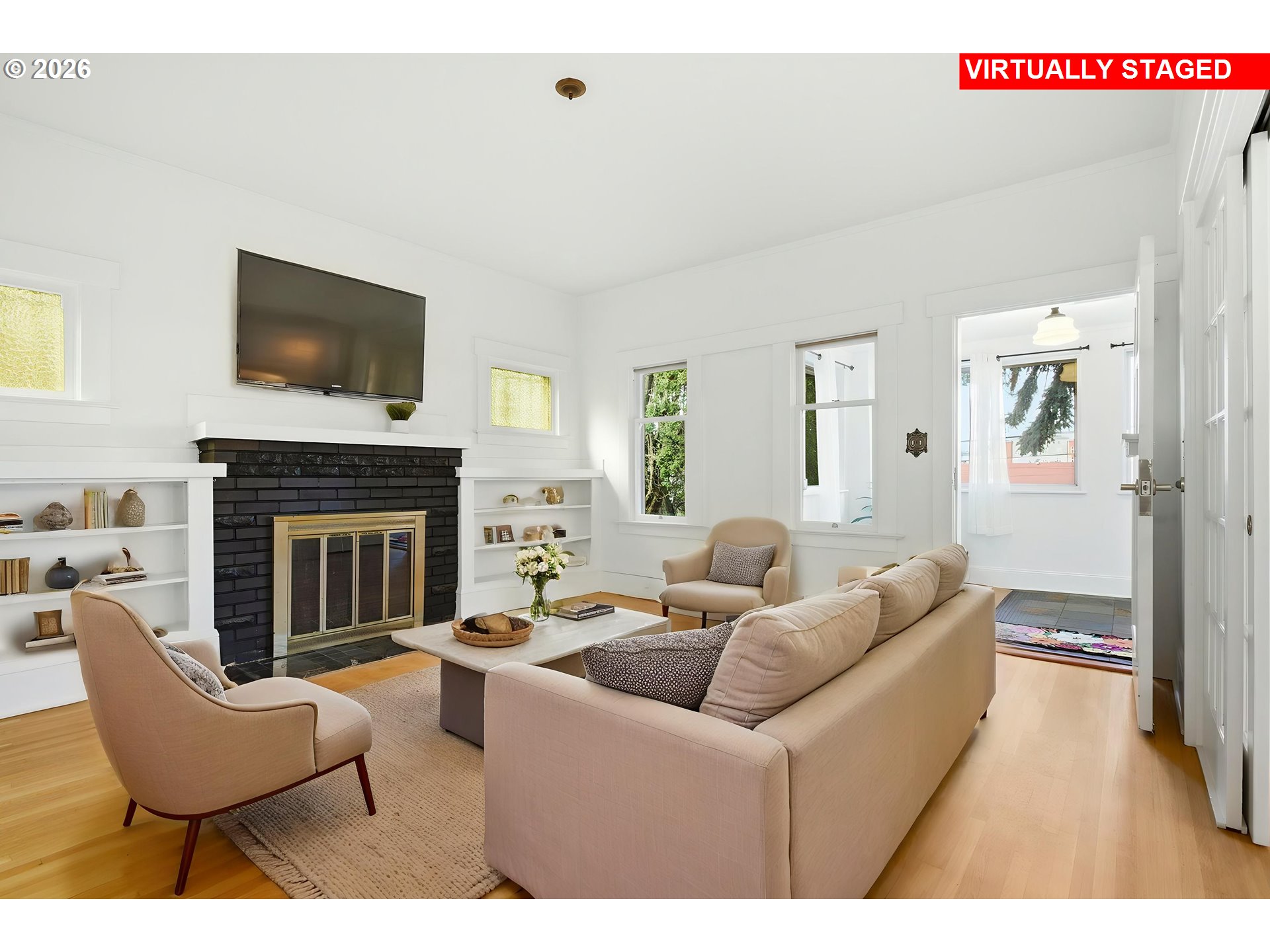 4036 Northeast Senate Street Portland, OR 97232 - Photo 7 of 48 a living room with furniture a flat screen tv and a fireplace