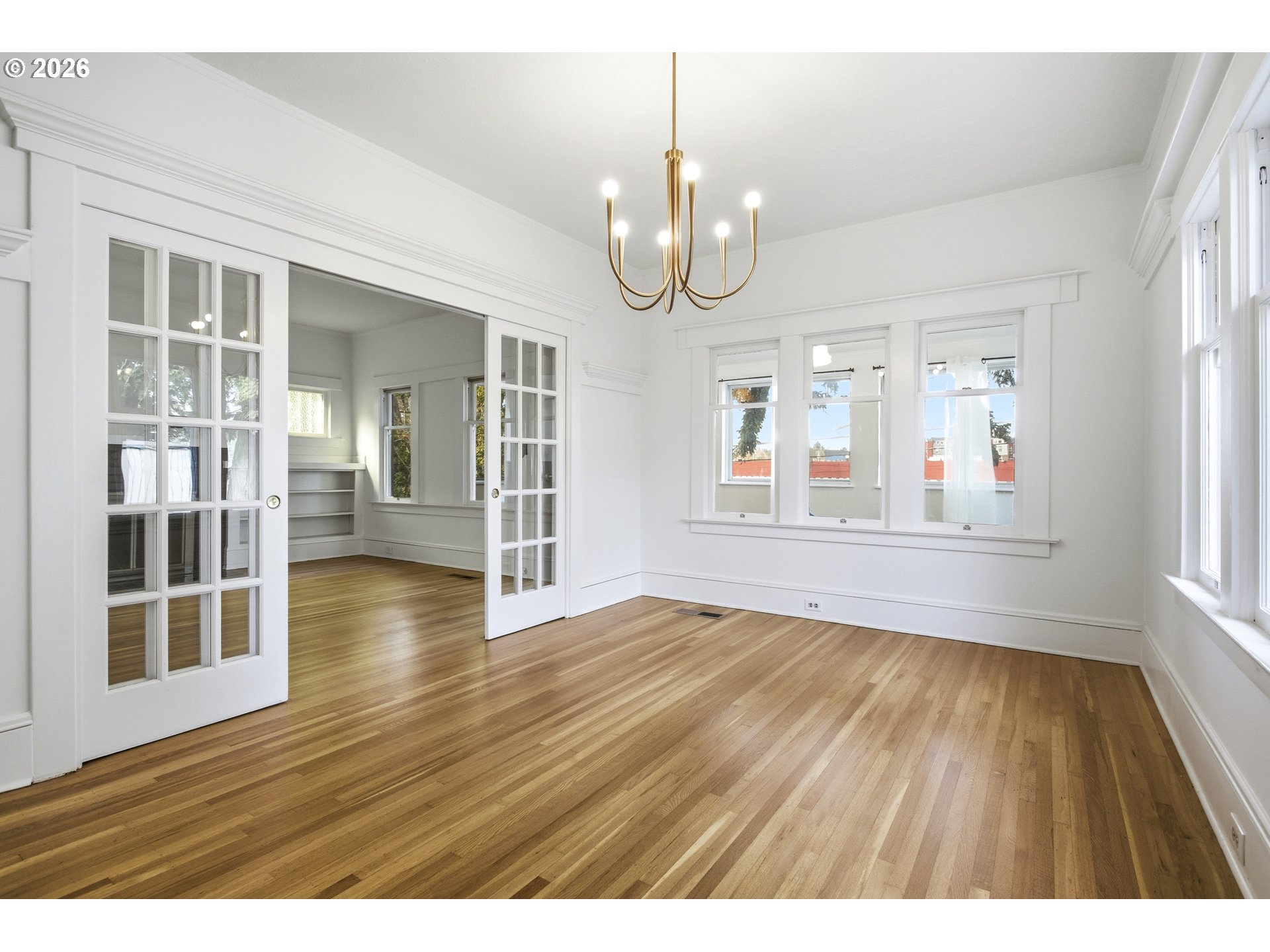 4036 Northeast Senate Street Portland, OR 97232 - Photo 8 of 48 wooden floor in an empty room with a window