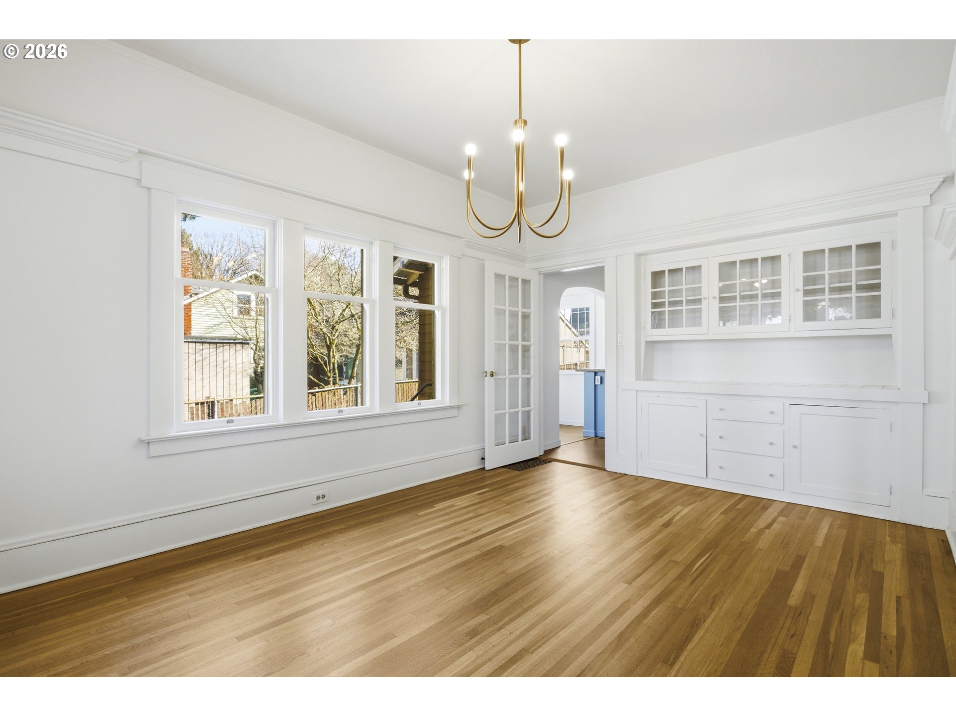 4036 Northeast Senate Street Portland, OR 97232 - Photo 9 of 48 a view of an empty room with wooden floor and windows