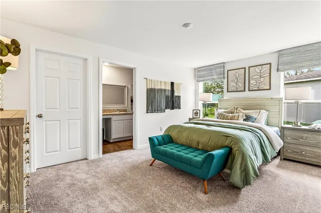 a spacious bedroom with a bed and a couch