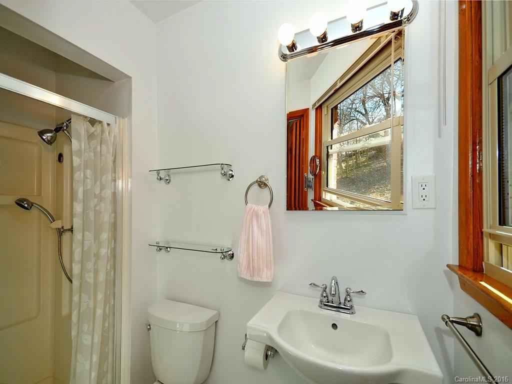 326 Robinson Road Clyde, NC 28721 - Photo 13 of 20 a bathroom with a sink toilet and shower