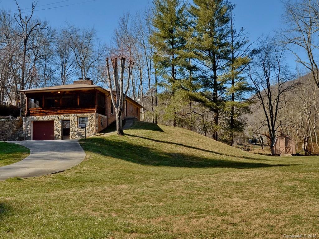 326 Robinson Road Clyde, NC 28721 - Photo 18 of 20 a front view of a house with a yard