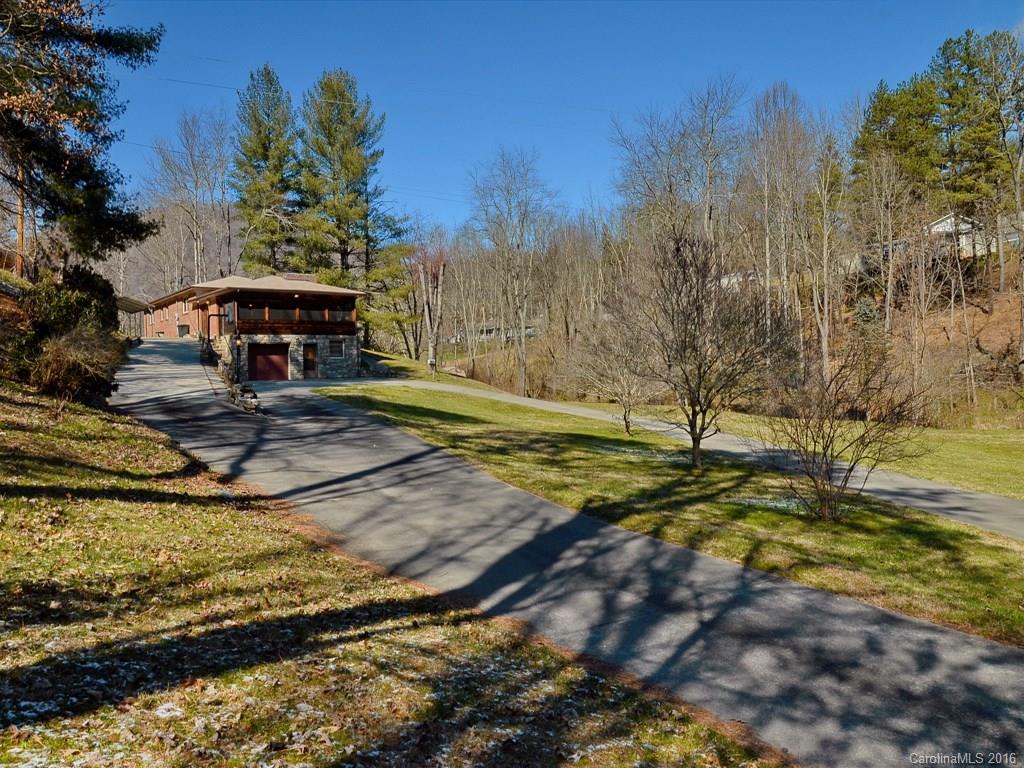 326 Robinson Road Clyde, NC 28721 - Photo 19 of 20 a view of a swimming pool with an outdoor space and seating area