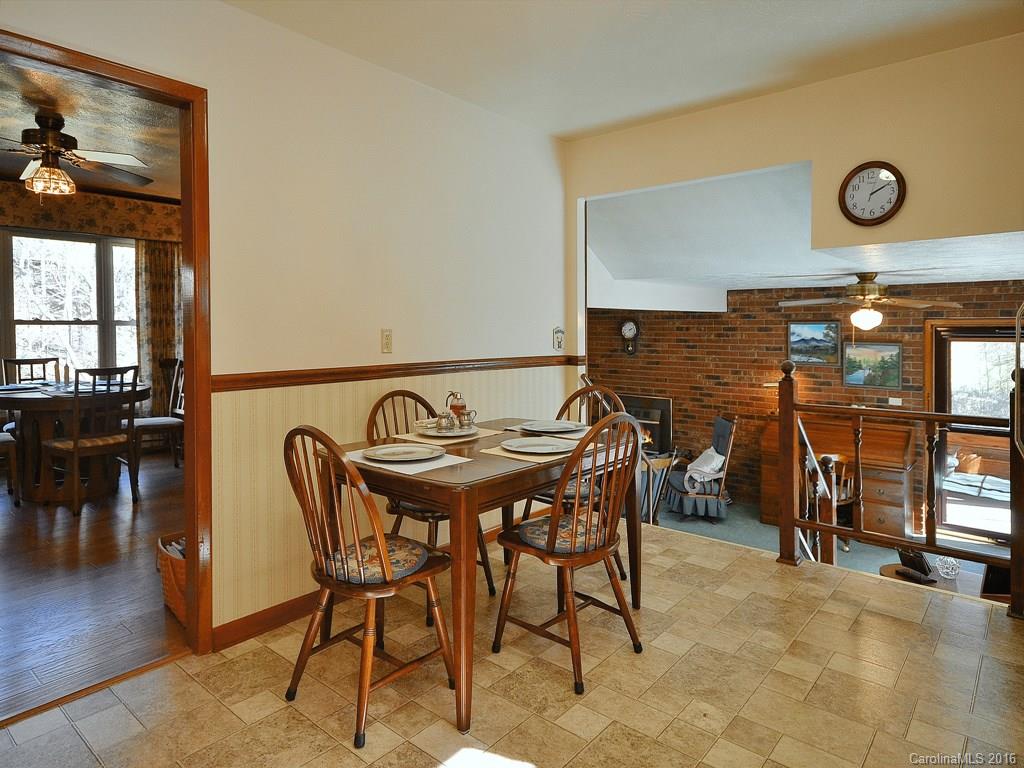 326 Robinson Road Clyde, NC 28721 - Photo 4 of 20 a view of a dining room with furniture and wooden floor