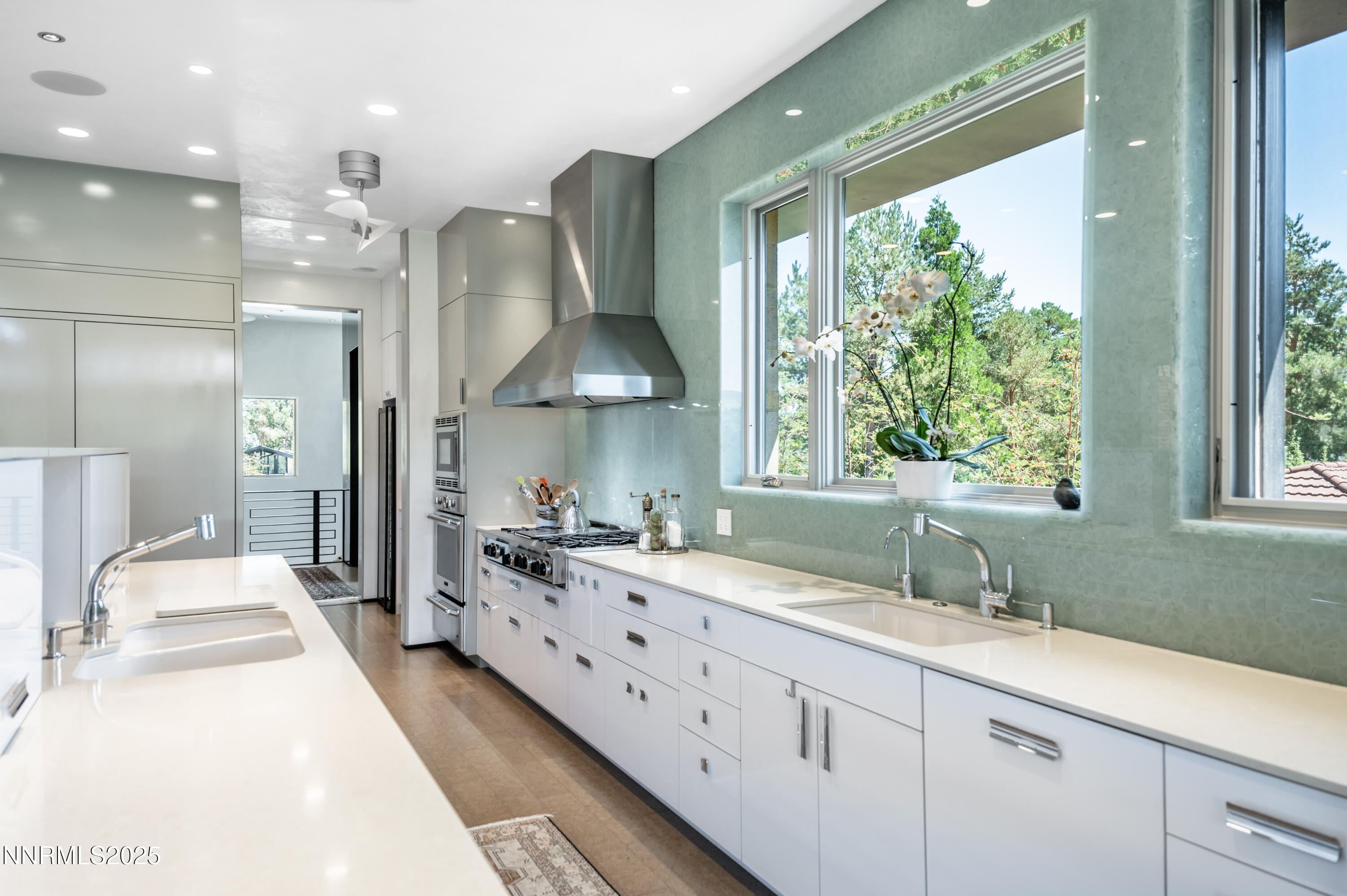 2345 Crescent Circle Reno, NV 89509 - Photo 14 of 37 a large white kitchen with a large window