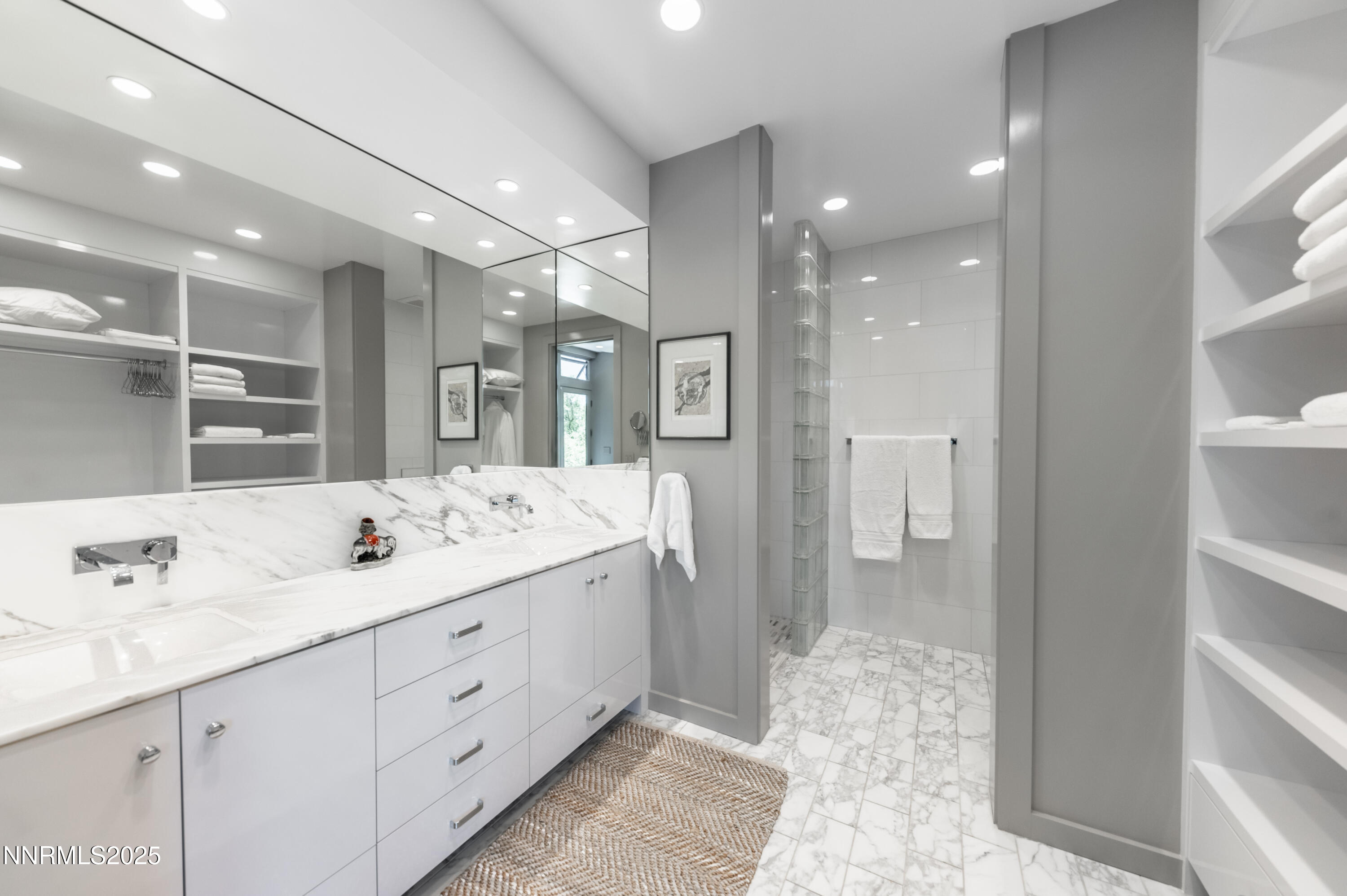 2345 Crescent Circle Reno, NV 89509 - Photo 24 of 37 a bathroom with a double vanity sink and a mirror