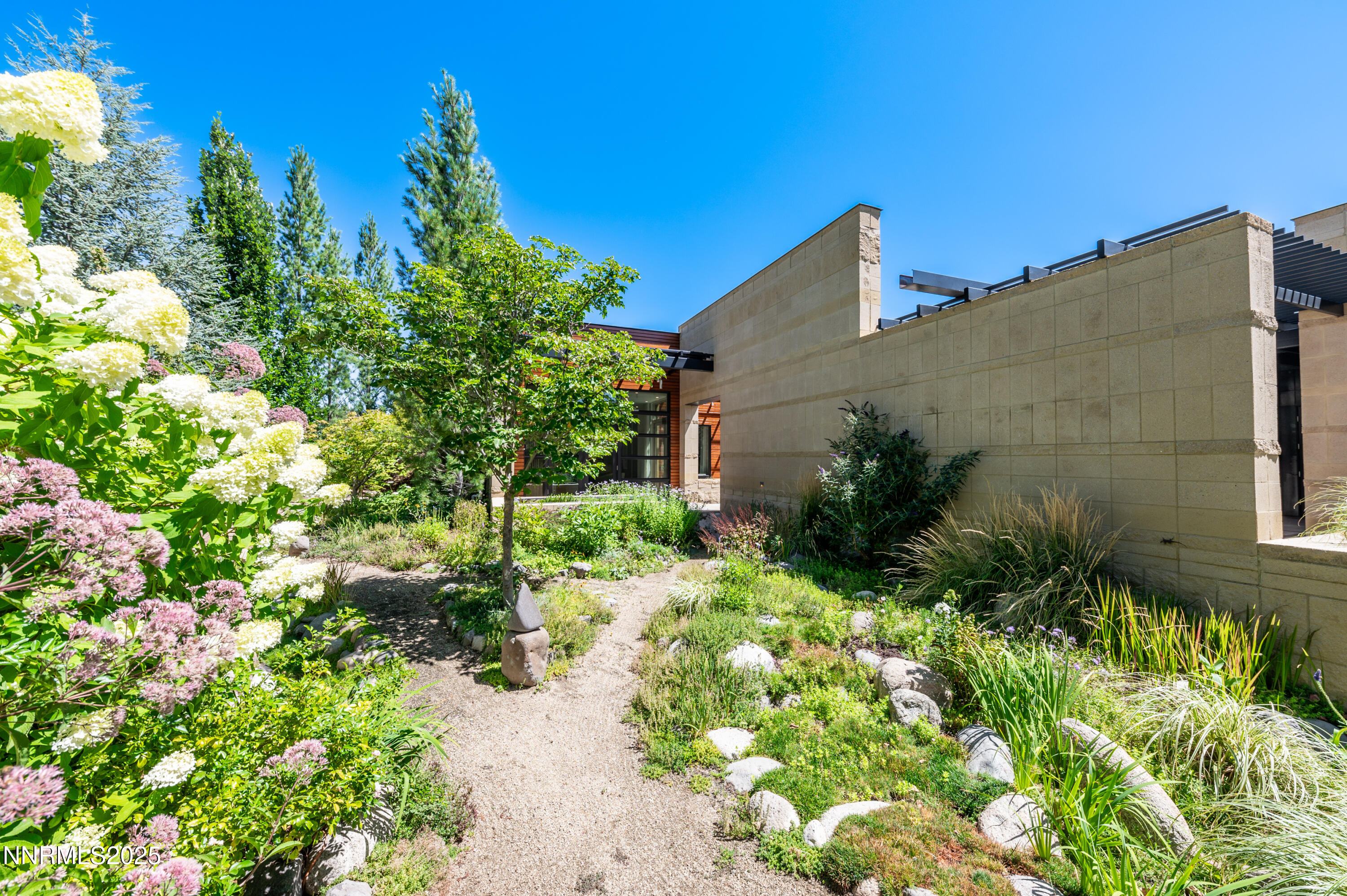 2345 Crescent Circle Reno, NV 89509 - Photo 30 of 37 a backyard of a house with a yard and outdoor seating