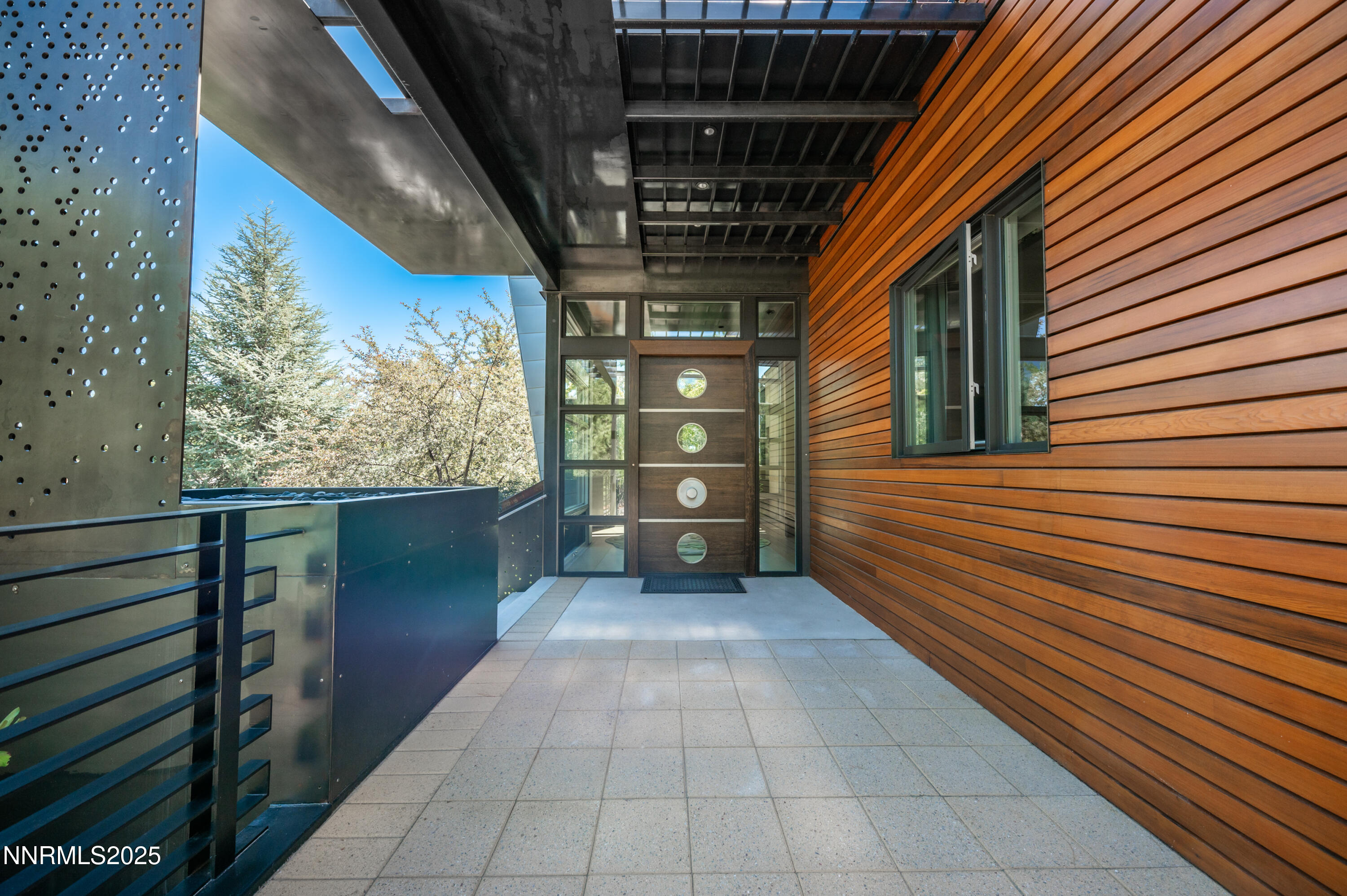 2345 Crescent Circle Reno, NV 89509 - Photo 5 of 37 a view of a porch with wooden floor and fence