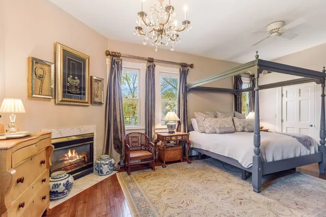 a bedroom with a bed couch and a window